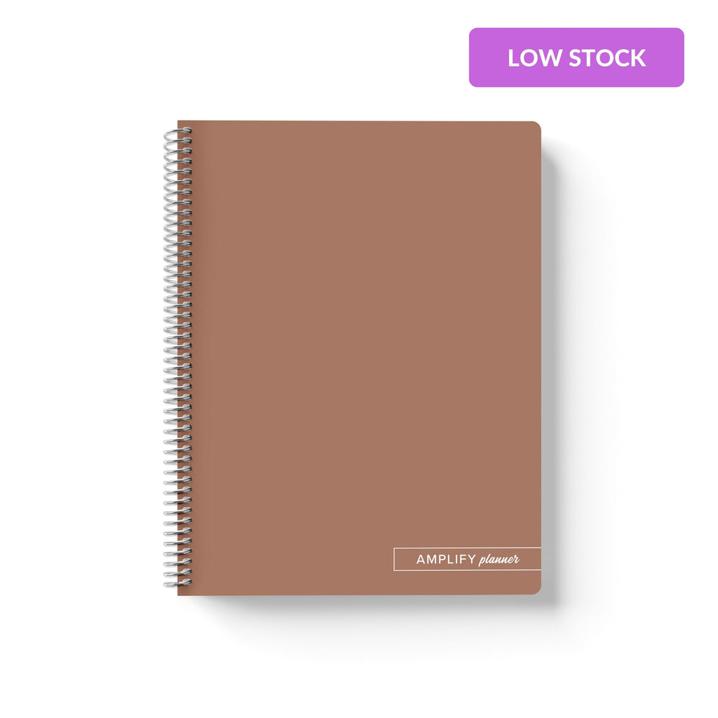 Rooted Brown Amplify Planner Spiral Notebook on a white background.