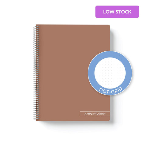 Rooted Brown Amplify Planner Spiral Notebook on a white background with an emblem designating Dot-Grid Paper. 