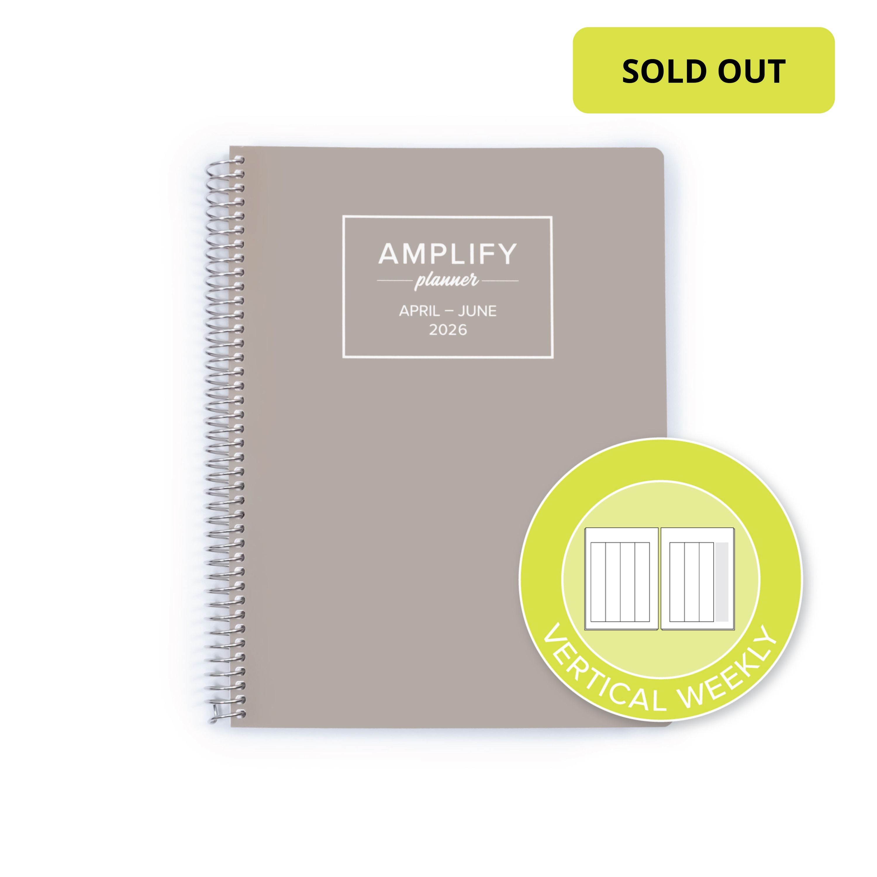 A spiral-bound planner shown on a white background with a lime green 'SOLD OUT' badge in the top right and a circular badge indicating vertical weekly inserts. The planner cover is taupe gray with white text reading 'AMPLIFY planner APRIL - JUNE 2026'.