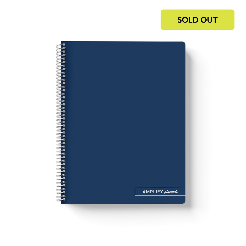 Midnight Pages Amplify Planner Spiral Notebook on a white background. 