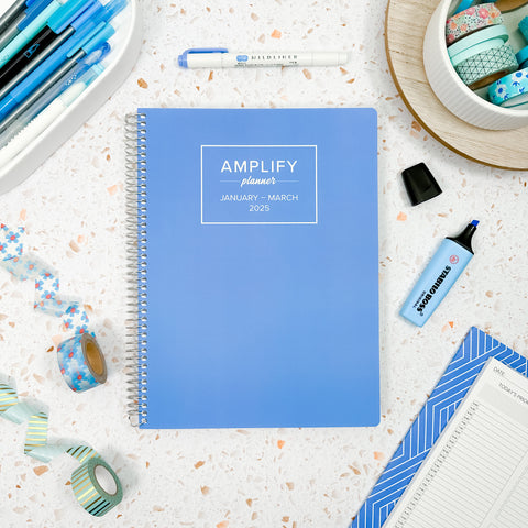 oasis blue cover of Amplify Planner Q1 2025 daily planner on a styled background
