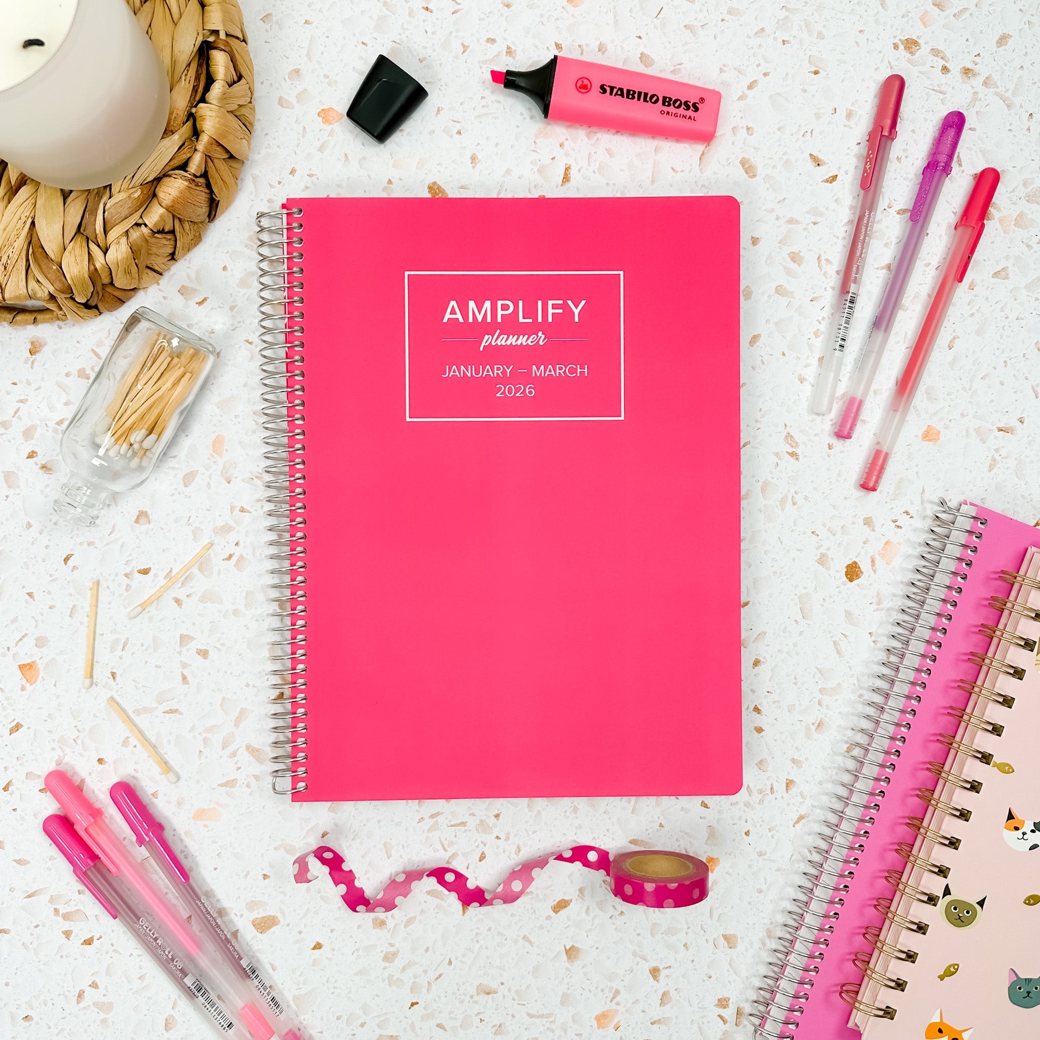 Daily Planner - January-March 2026 - Let It Be Pink surrounded by stationery items, showcasing its vibrant design.