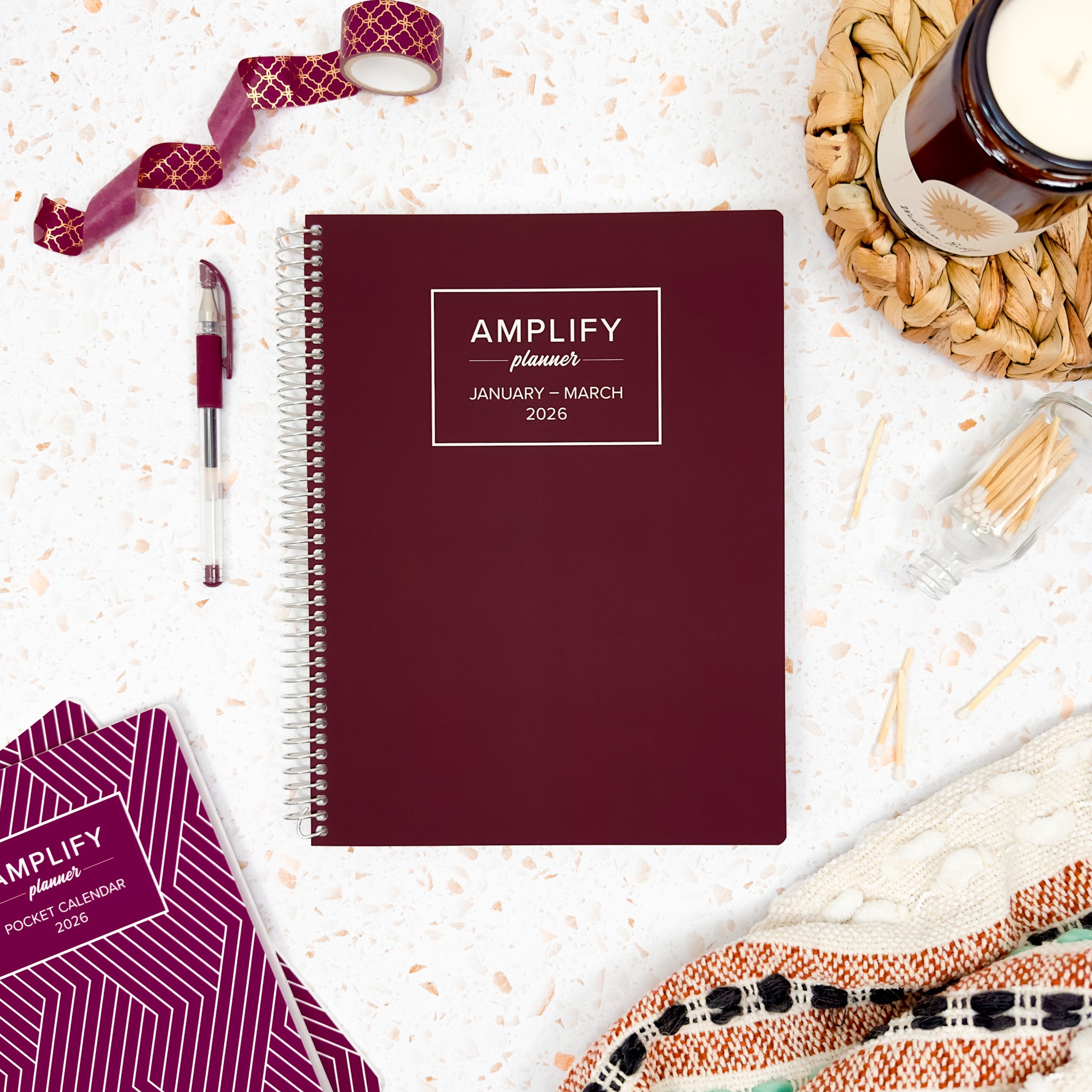 Daily Planner - January-March 2026 – This Is Maroon displayed among accessories, featuring the Amplify Planner logo, perfect for organizing your schedules and goals in style.