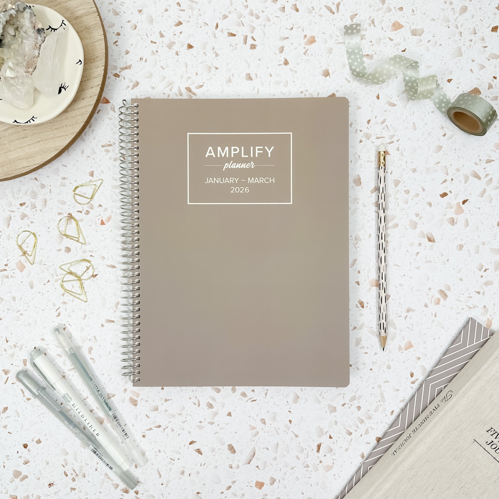 Daily Planner - January-March 2026 - Gentle Grey displayed with stationery items on a textured background.