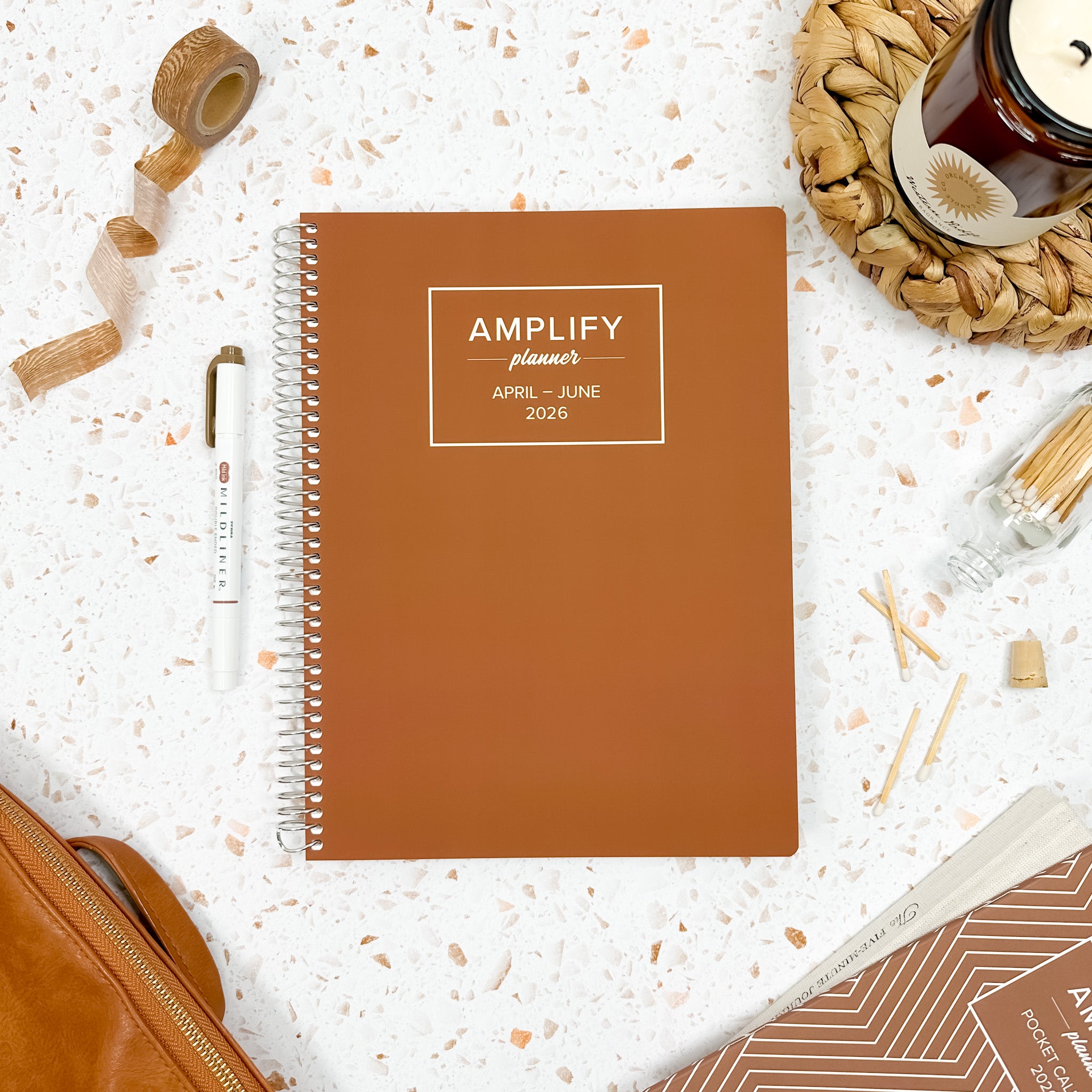 Daily Planner - April-June 2026 - In My Season displayed with stationery items on a textured background.
