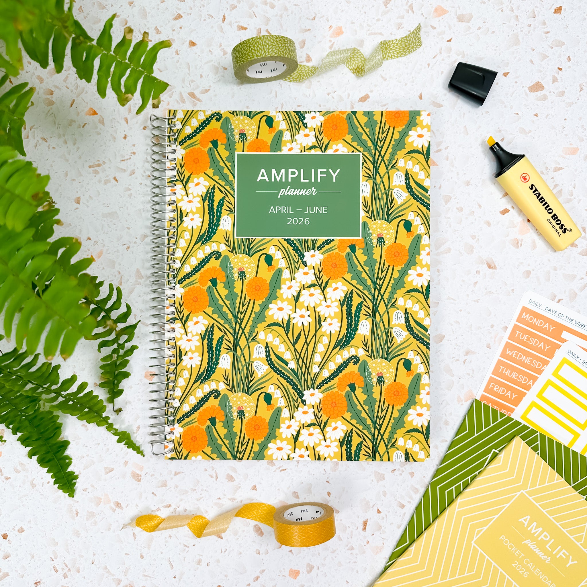 Daily Planner - April-June 2026 - Where Wishes Grow displayed with stationery items on a textured background.