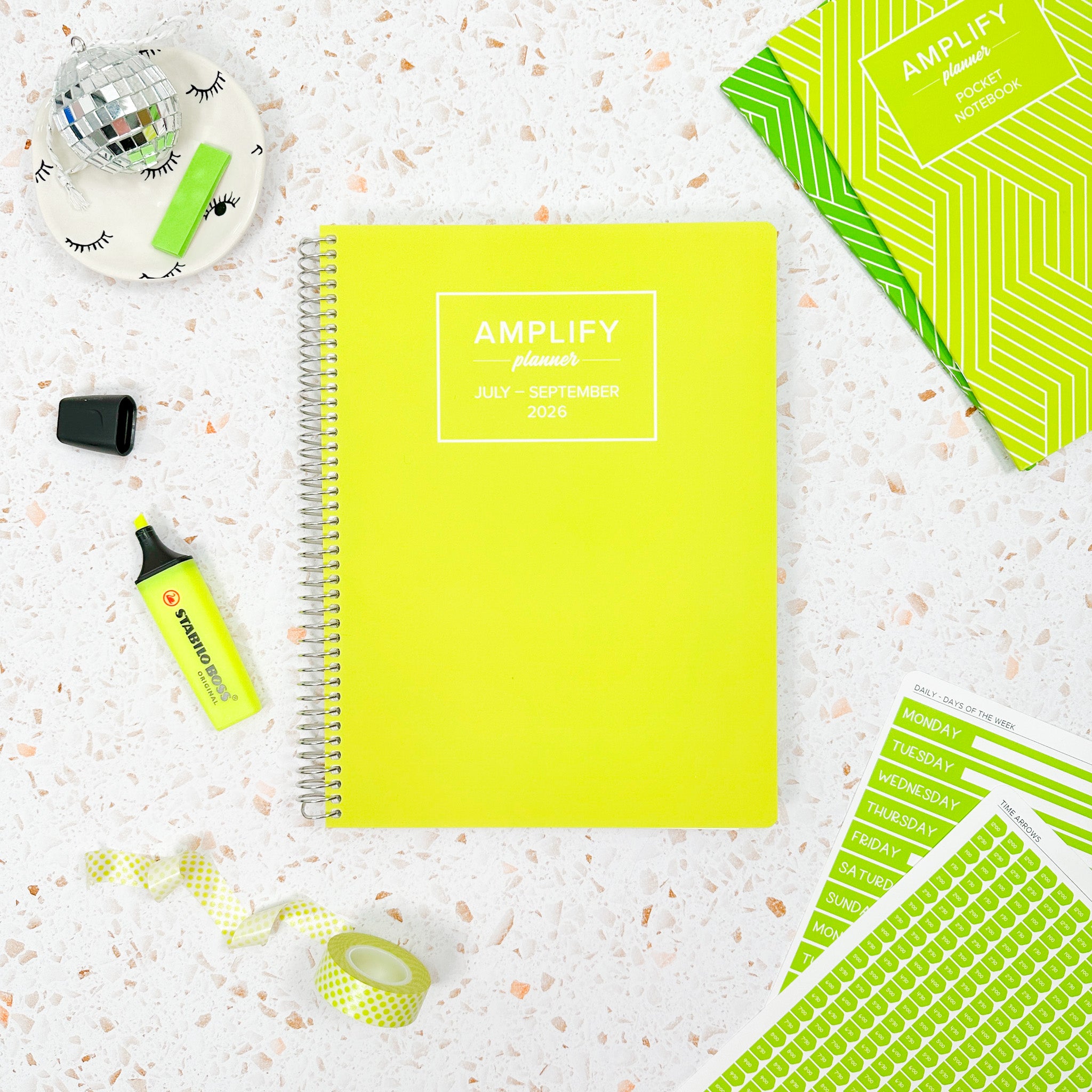 Daily Planner - July-September 2026 - Electric Yuzu displayed on a stylish desk, surrounded by planner accessories and decor.