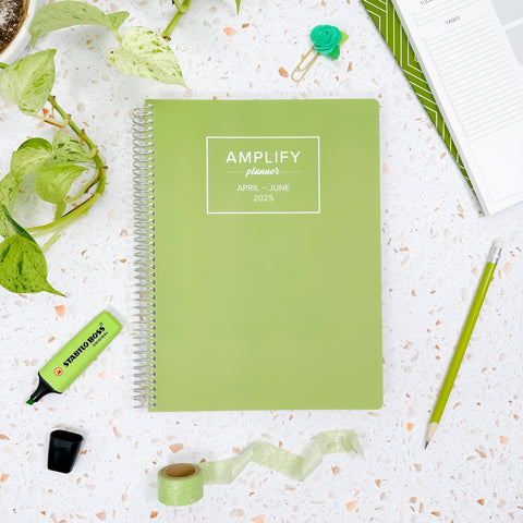 dewdrop green 2025 daily amplify planner on styled background