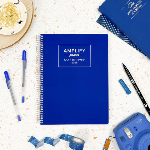 lagoon blue 2025 daily amplify planner on styled background