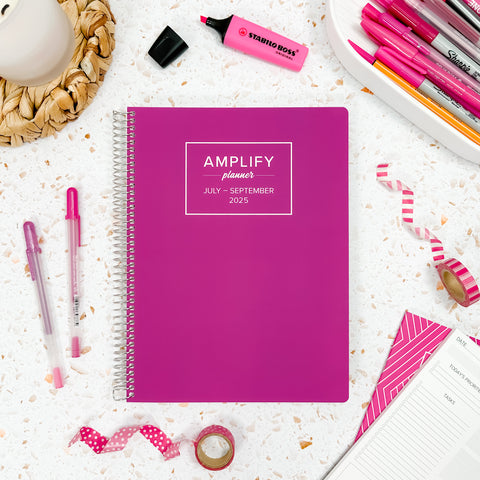 wild fuchsia 2025 daily amplify planner on styled background