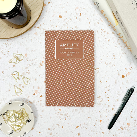 grounded routine 2026 amplify planner pocket calendar styled with accessories and decor
