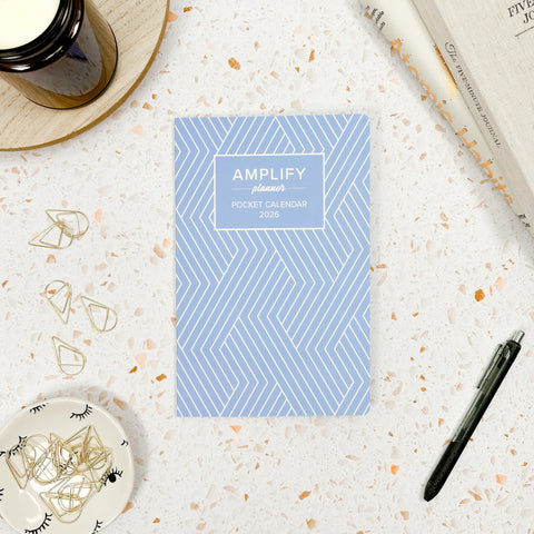 soft focus blue 2026 amplify planner pocket calendar styled with accessories and decor