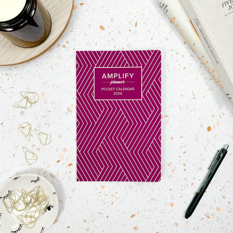 bold berry 2026 amplify planner pocket calendar styled with accessories and decor