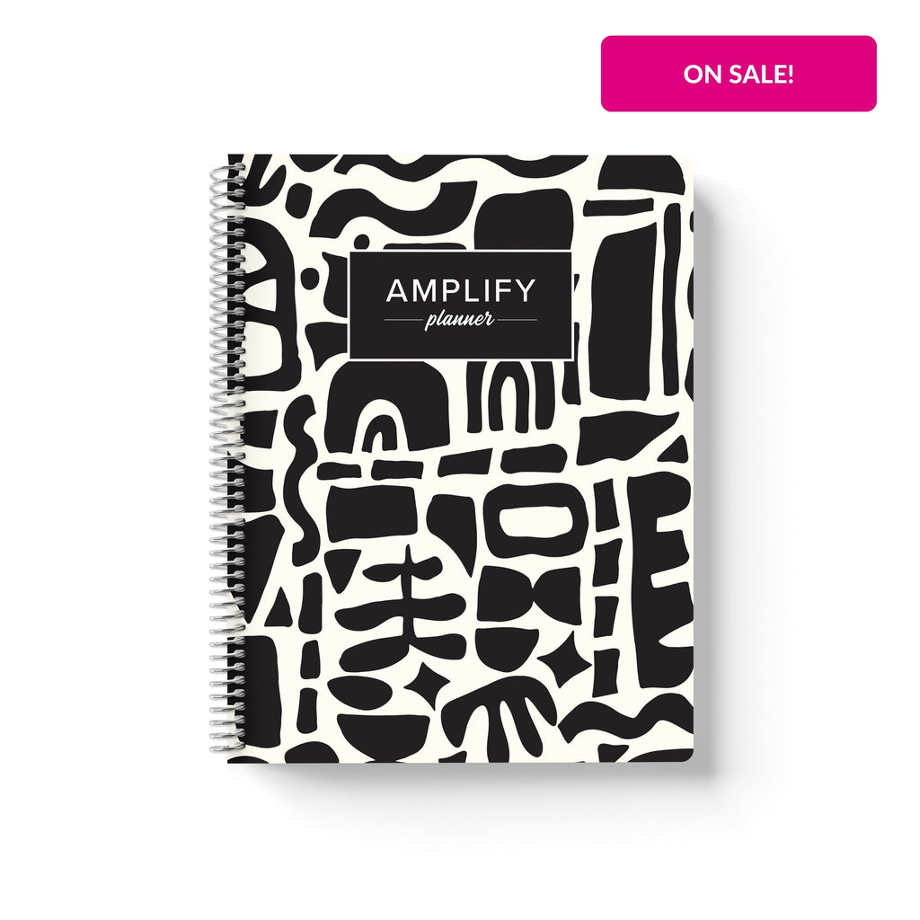 abstract collage cover of undated daily Amplify Planner  on a white background