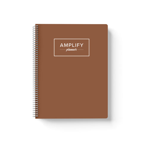 Begin Again Brown cover of undated daily Amplify Planner daily planner on a white background
