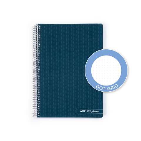 A dark teal spiral-bound planner shown on a white background, with a circular inset labeled 'DOT-GRID' highlighting the dot-grid feature on the cover.