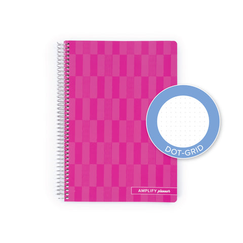 A pink spiral-bound planner with a checkerboard pattern cover, shown on a white background with a blue circular inset labeled 'DOT-GRID'.