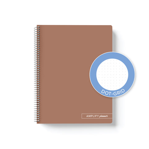 Rooted Brown Amplify Planner Spiral Notebook on a white background with an emblem designating Dot-Grid Paper. 