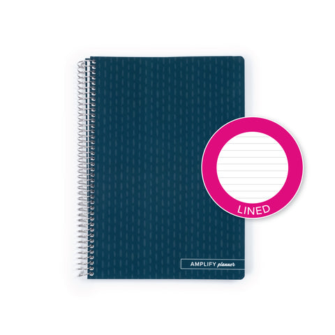 A dark teal spiral-bound planner shown on a white background, with a bright pink circular sticker overlay that reads 'LINED'. The planner cover has a subtle geometric pattern and the brand name 'AMPLIFY planners' is visible at the bottom.