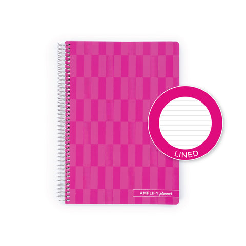 A pink spiral-bound planner with a checkerboard pattern cover, shown on a white background with a circular inset showing the lined 'lined' page inside.