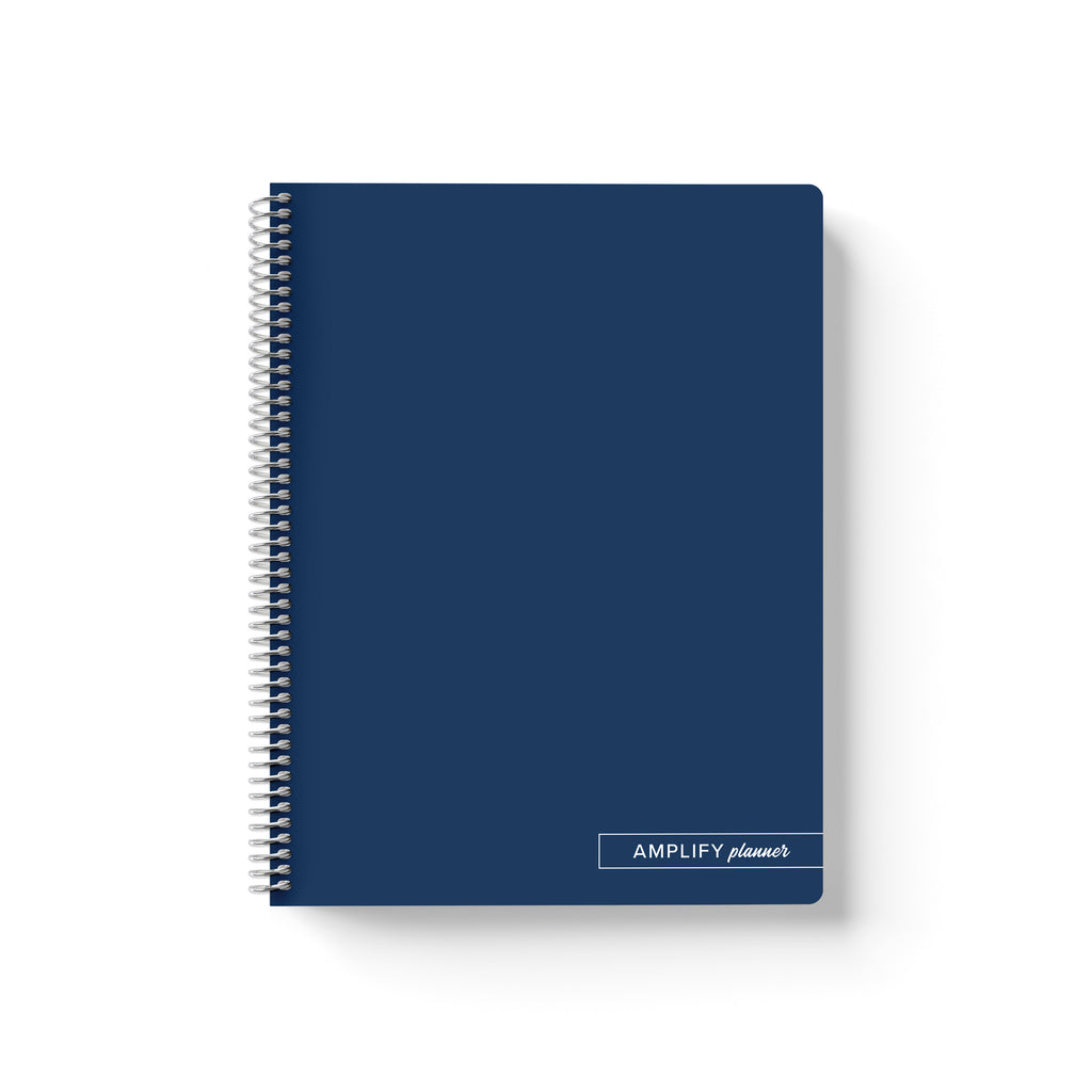 Midnight Pages Amplify Planner Spiral Notebook on a white background. 