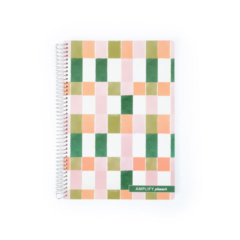 Painted Mosaic Spiral Notebook showcasing a colorful grid pattern on the cover, perfect for organization and creativity.