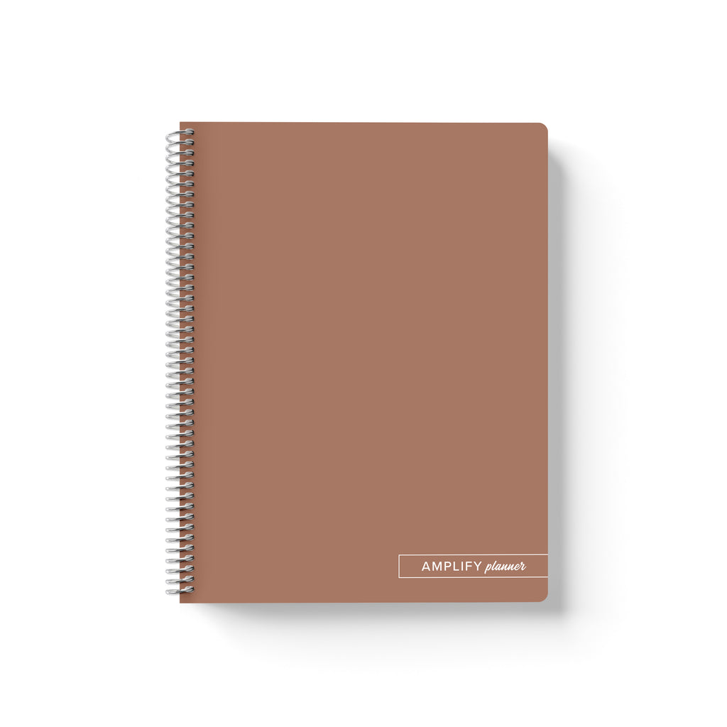 Rooted Brown Amplify Planner Spiral Notebook on a white background.