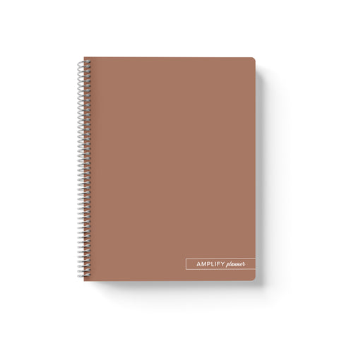 Rooted Brown Amplify Planner Spiral Notebook on a white background.