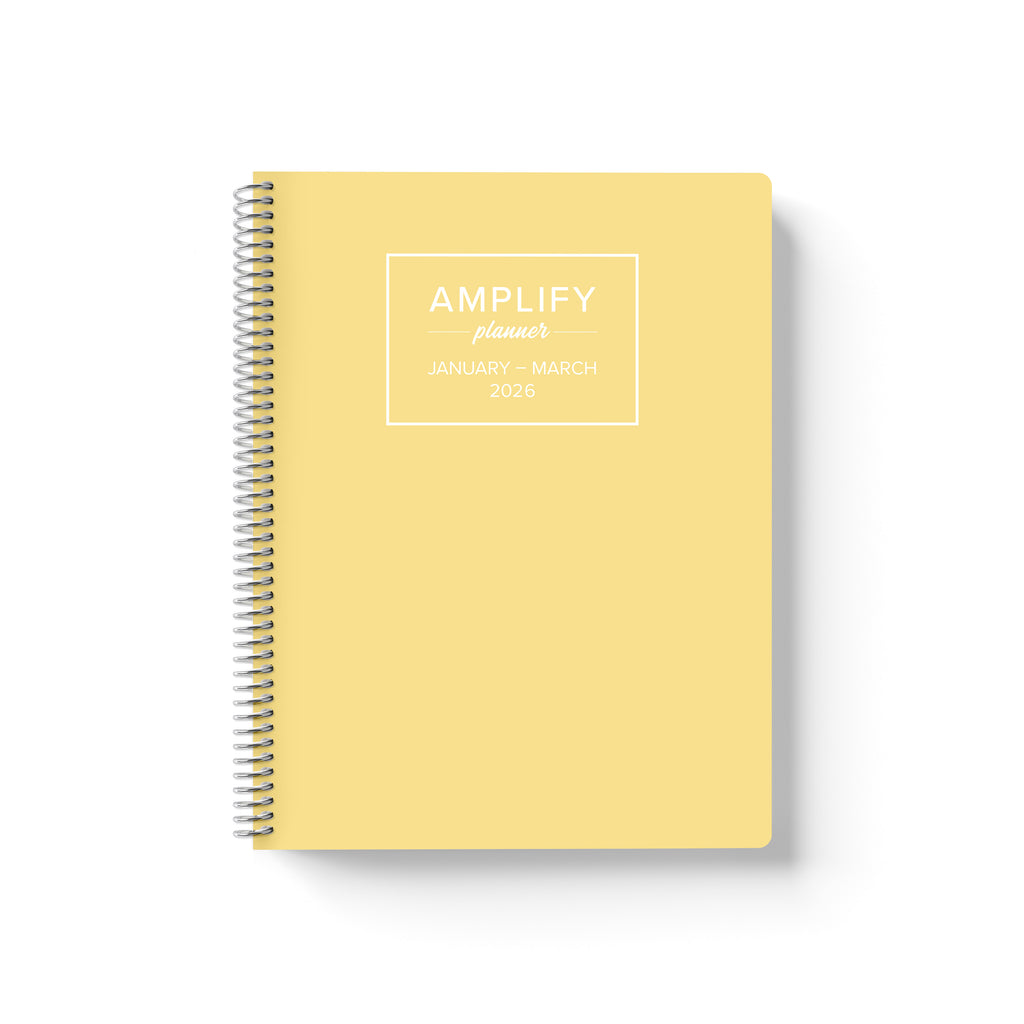 Daily Planner - January-March 2026, front cover featuring a yellow design with the title 'AMPLIFY planner' prominently displayed.